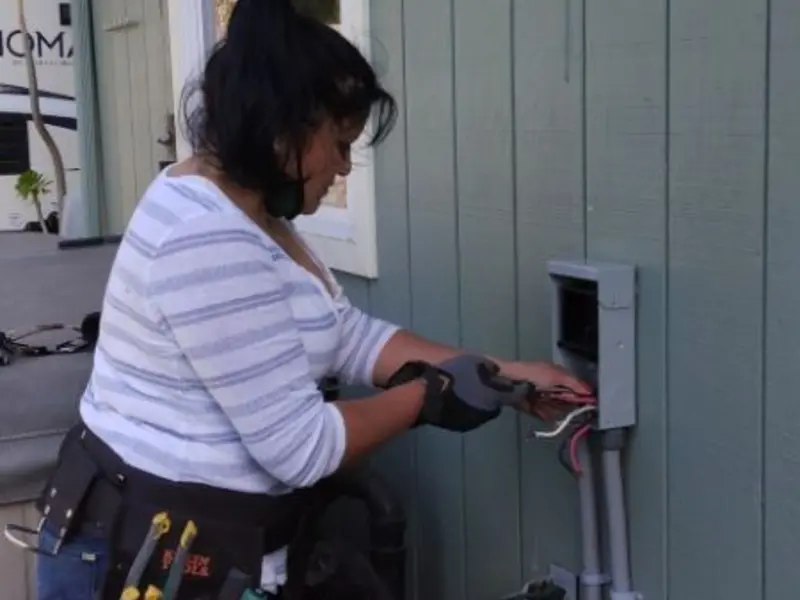 Licensed electrician wiring an exterior subpanel in Jersey Shore